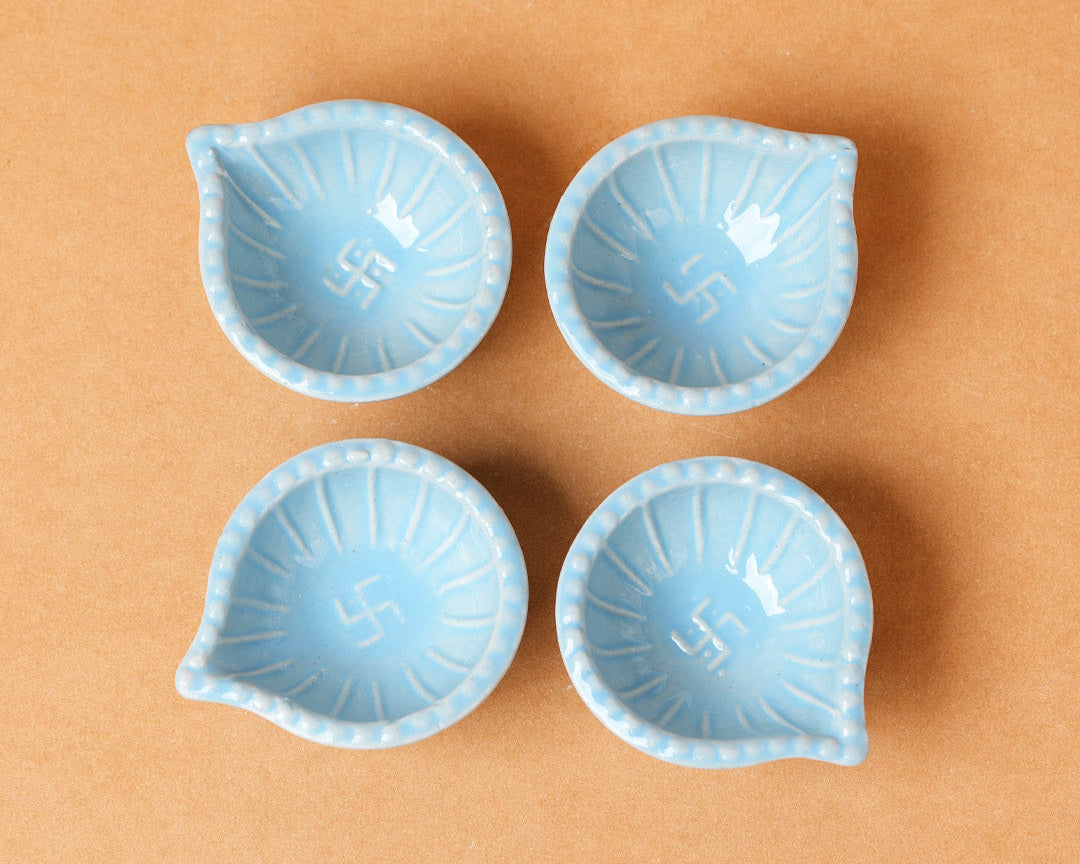 Sky Blue Swastik Clay Diyas - Set of 4