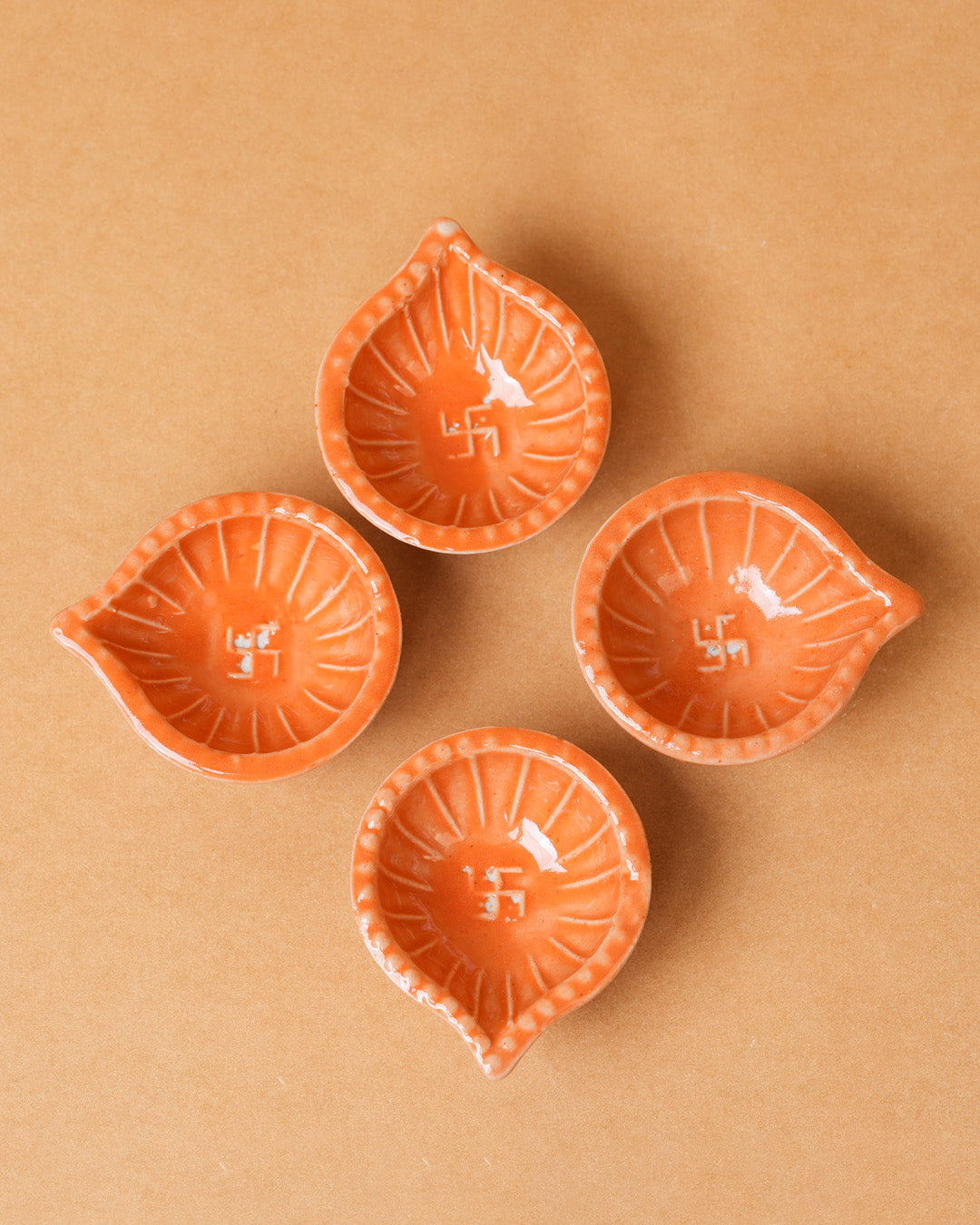 Orange Swastik Clay Diyas - Set of 4
