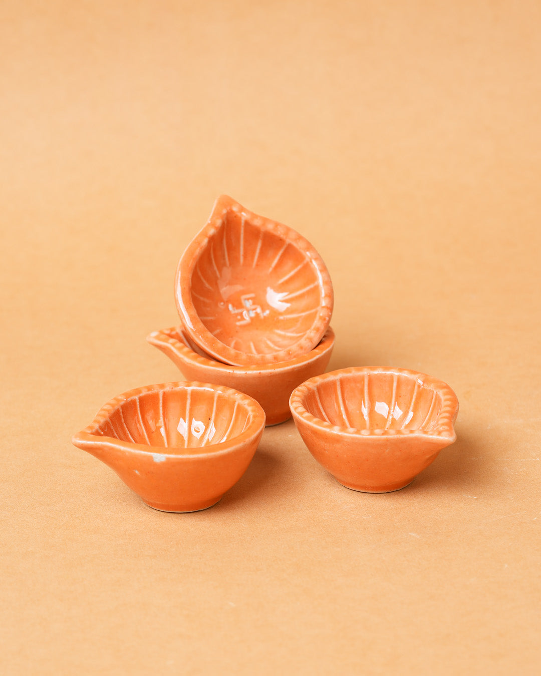Orange Swastik Clay Diyas - Set of 4