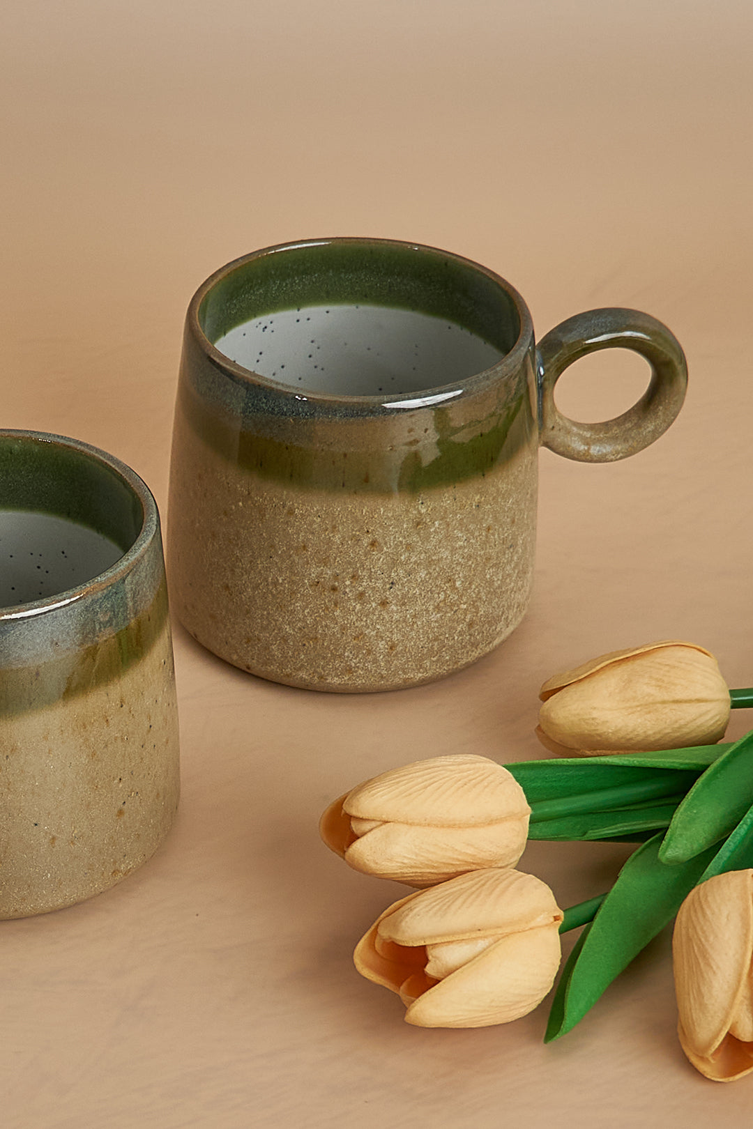 a couple of mugs sitting on top of a table