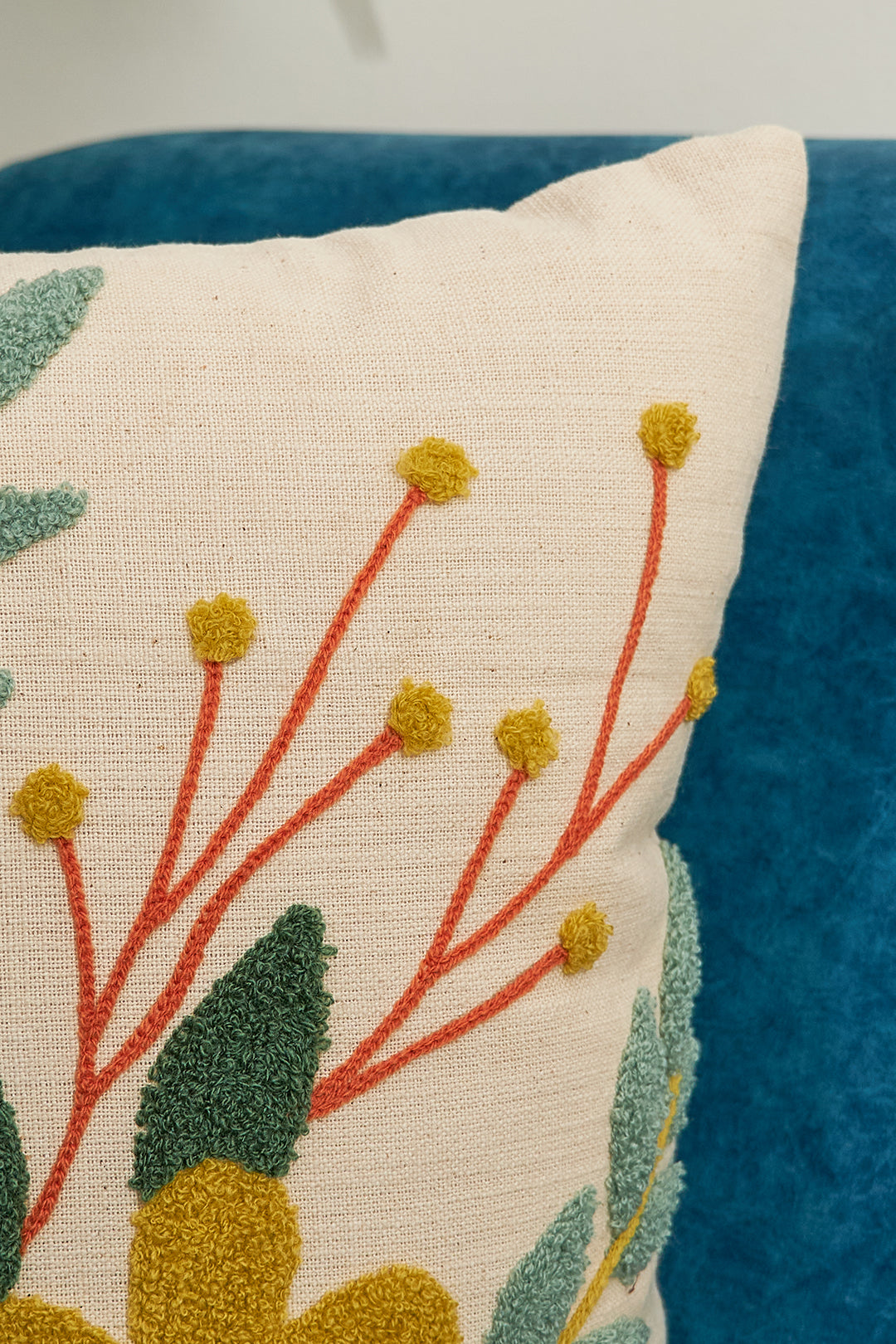 a close up of a pillow on a couch