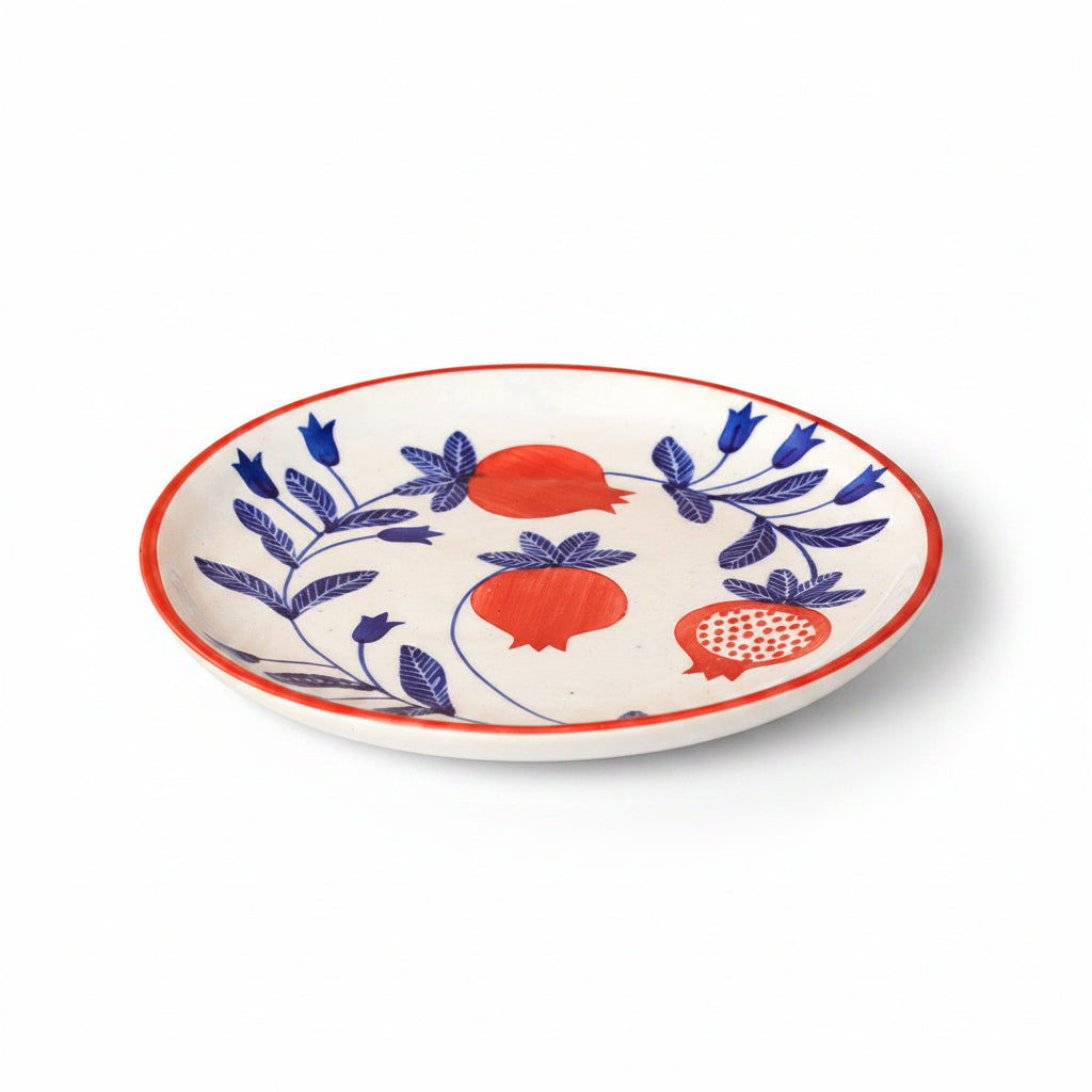 Decorative plate with red and blue floral patterns on a beige background