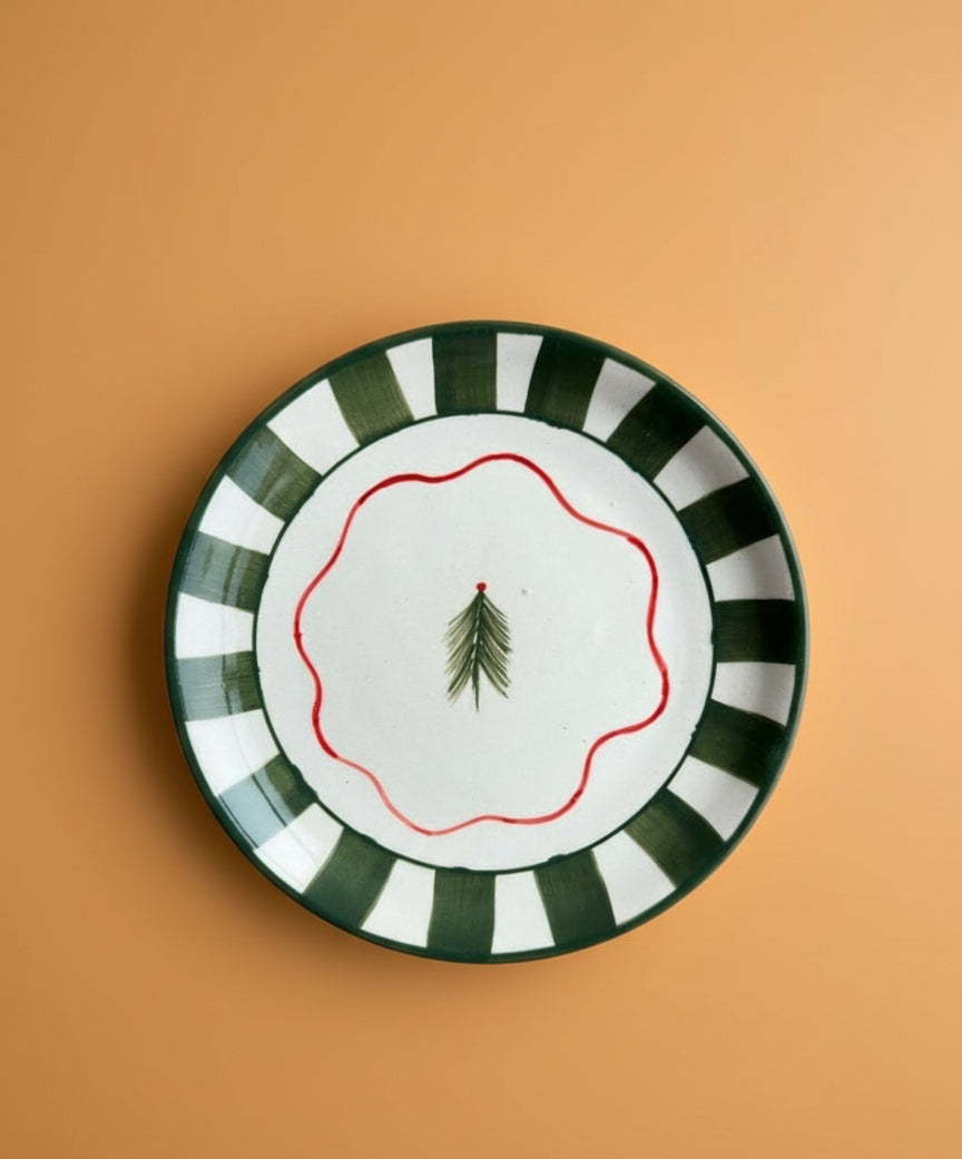 Decorative plate with green and white stripes on a brown background