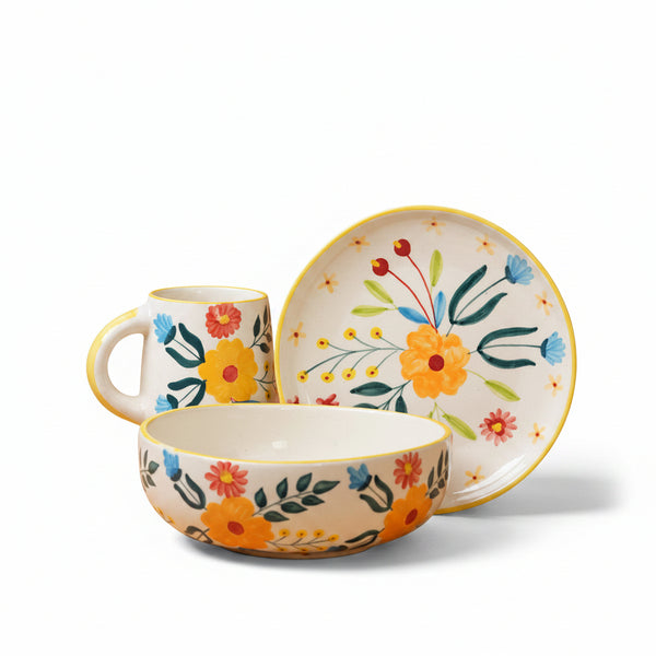 Ceramic tableware set with floral design on a brown background