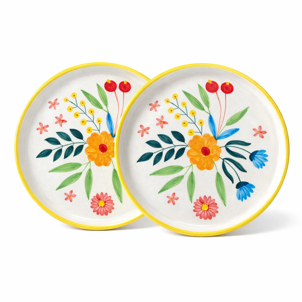 Two ceramic plates with floral designs on a white background