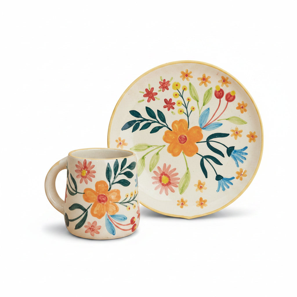 A floral patterned ceramic mug and plate set on a neutral background.