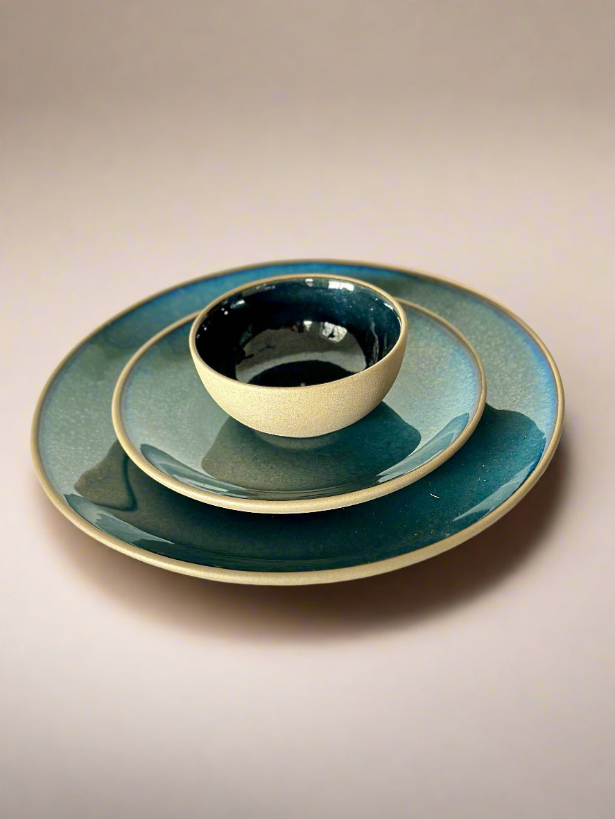 Ceramic dish set with a bowl and plate on a marble surface