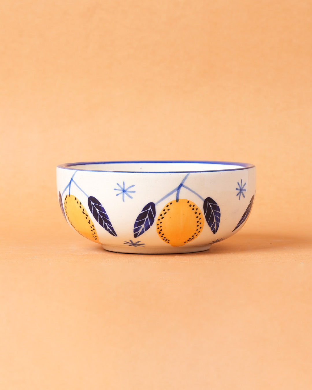 Ceramic bowl with decorative design on a beige background