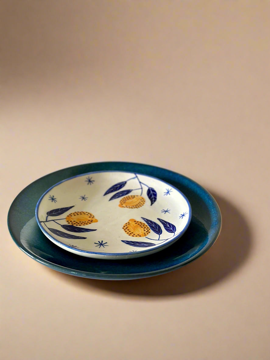 Ceramic plate with floral design on a beige background