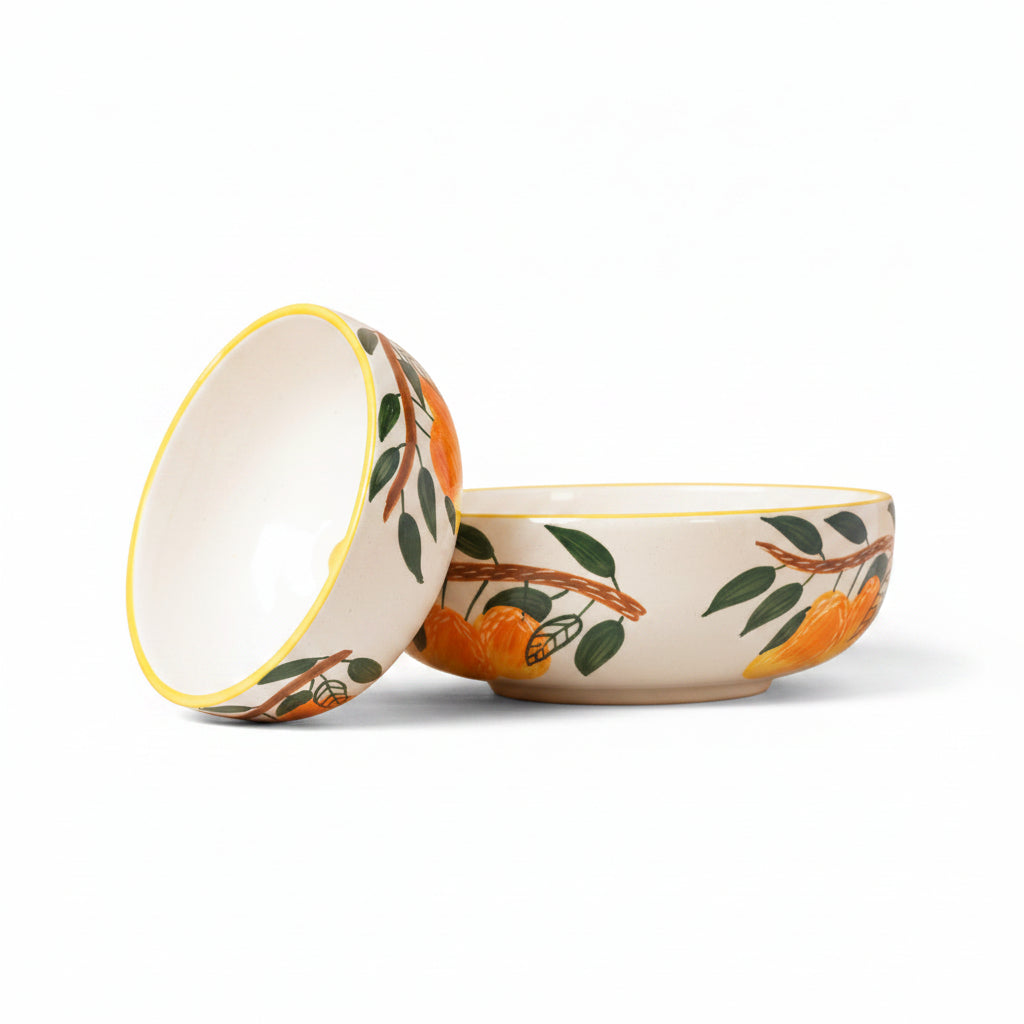 Two ceramic bowls with floral patterns on a beige background