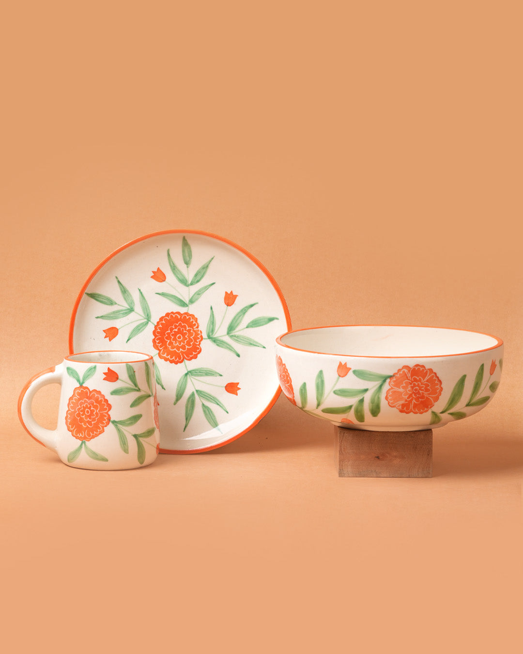 Ceramic tableware set with floral design on a beige background
