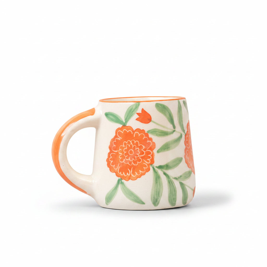 Ceramic mug with floral design on a peach background