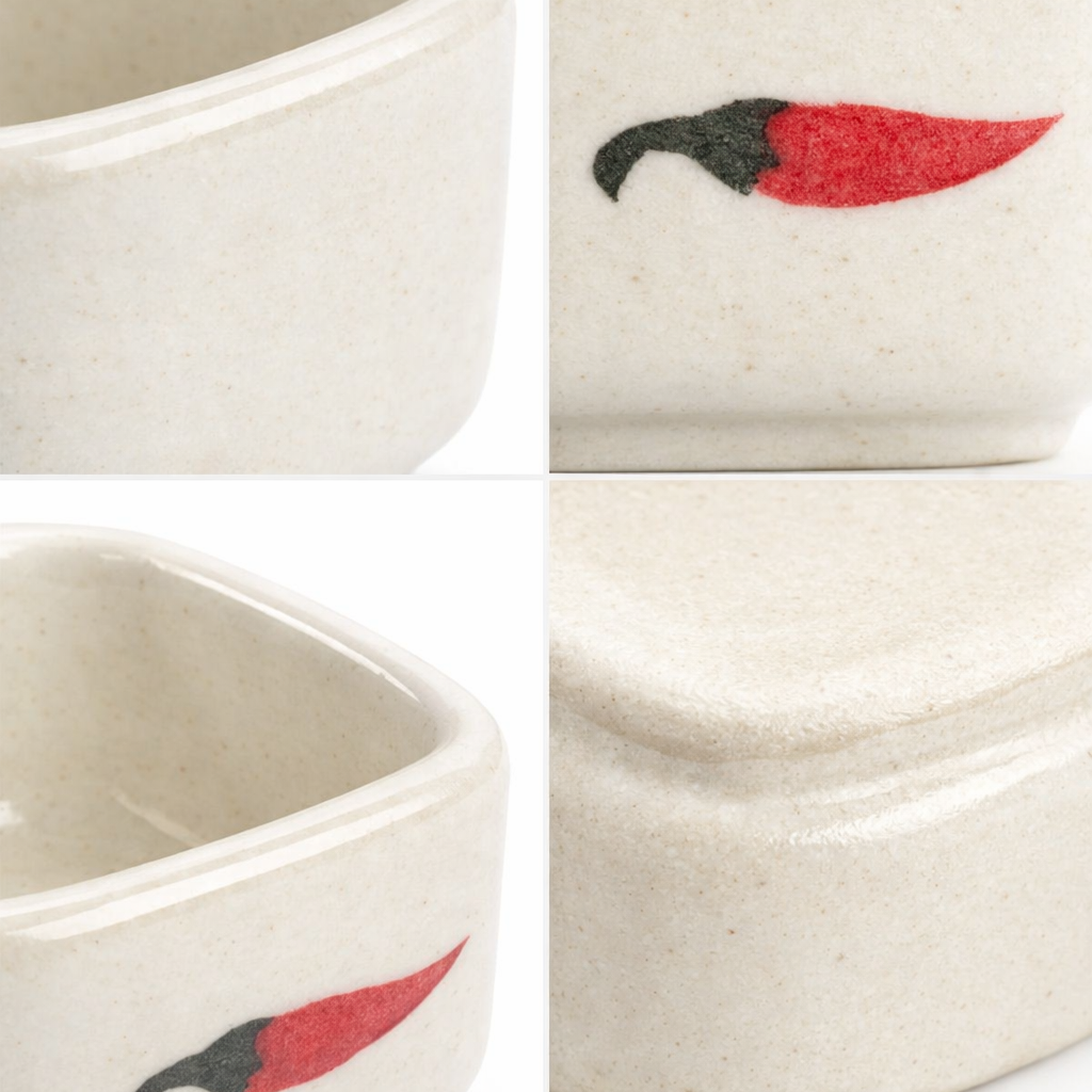 A four-panel close-up collage of a small square ceramic container with a lid. The container has a speckled off-white glaze and is decorated with a chili pepper motif in red and black.