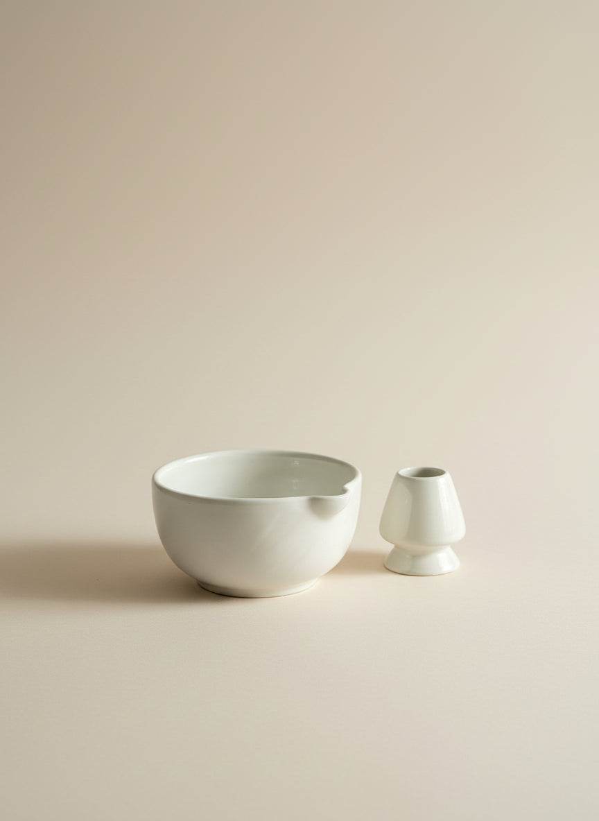 Two white ceramic bowls on a beige background