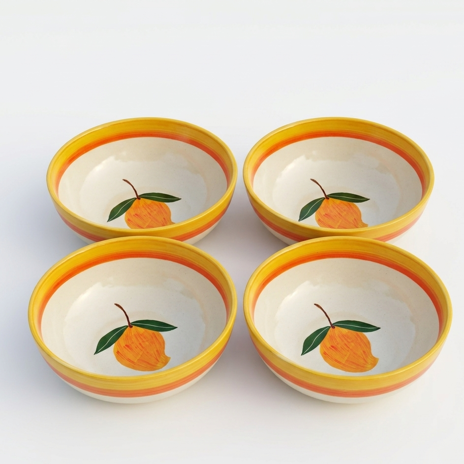 Four ceramic bowls with orange designs on a white background