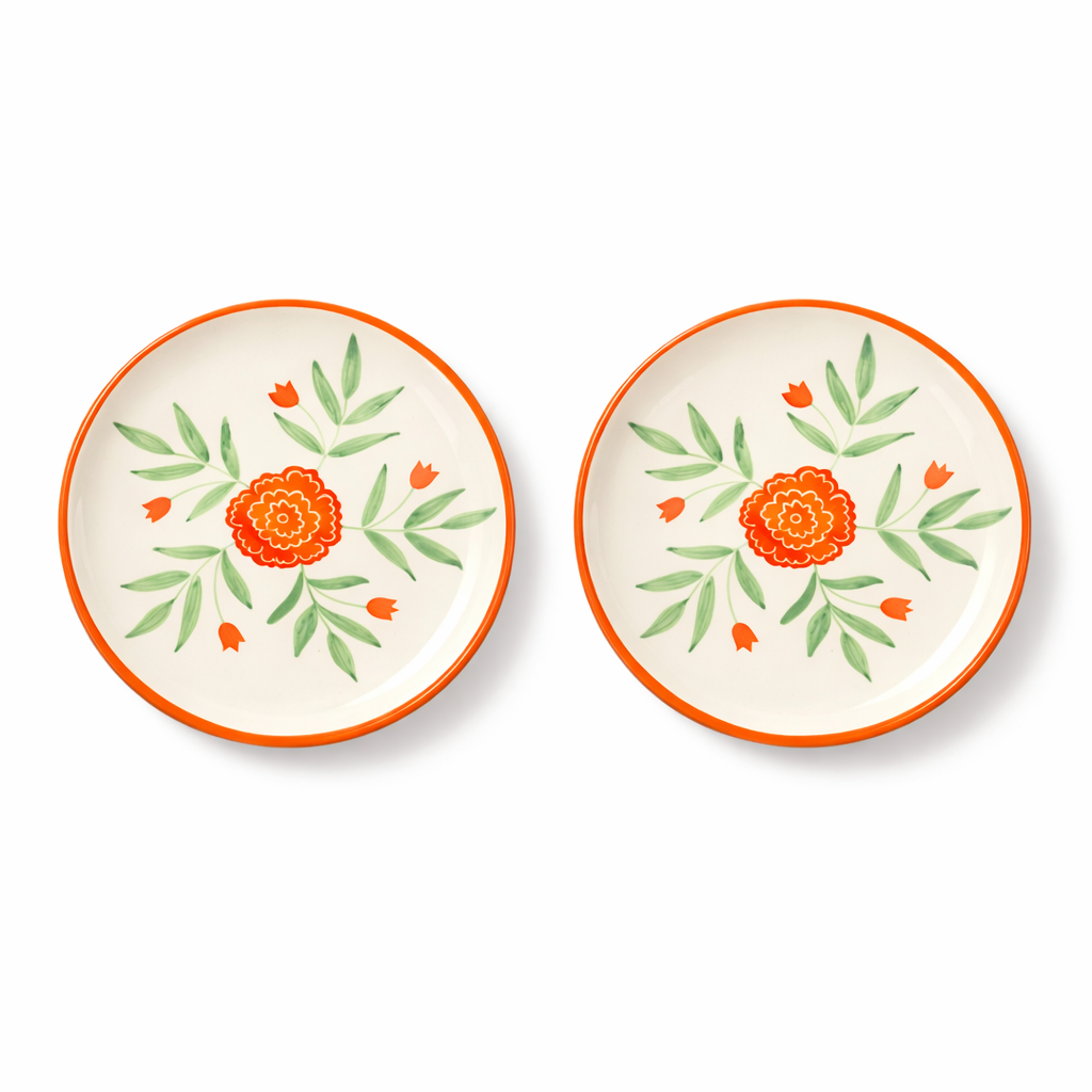 Two ceramic plates with floral designs on a white background