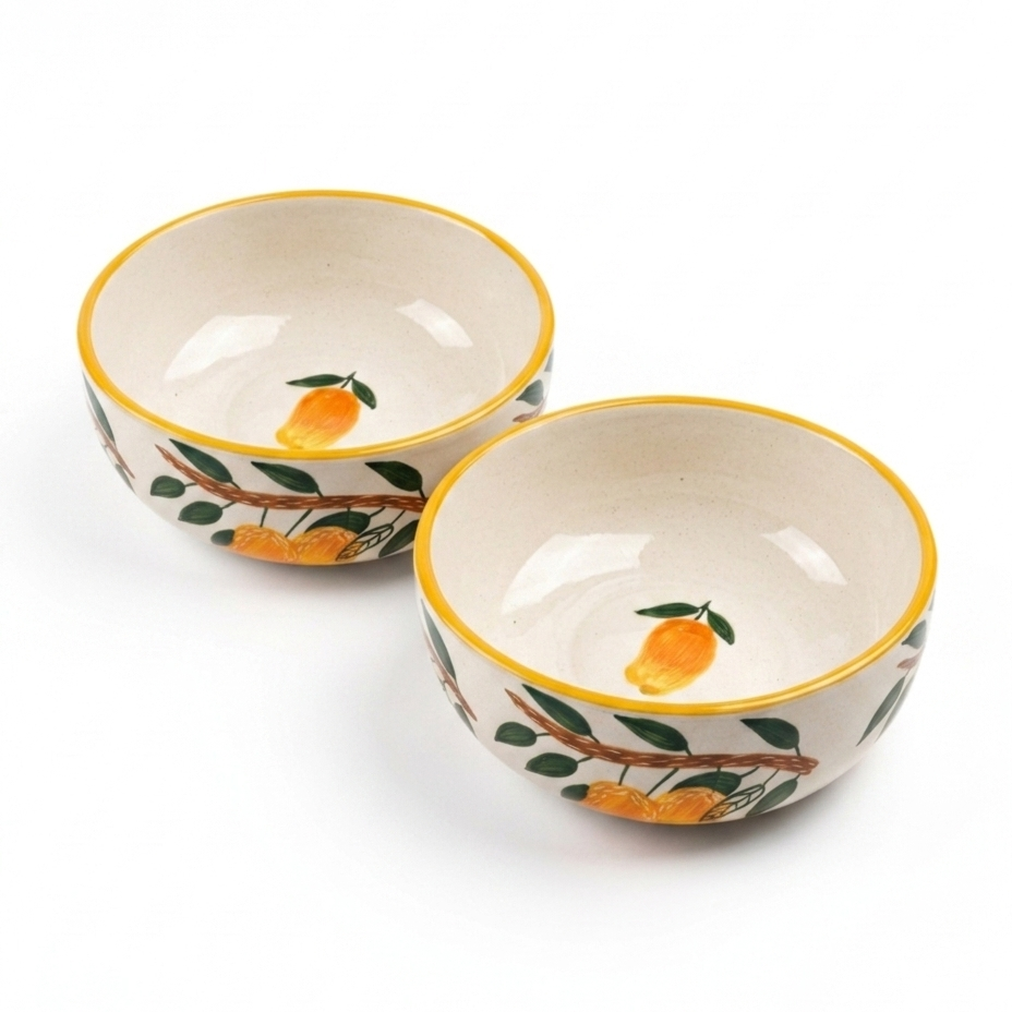 Two ceramic bowls with orange design on a white background
