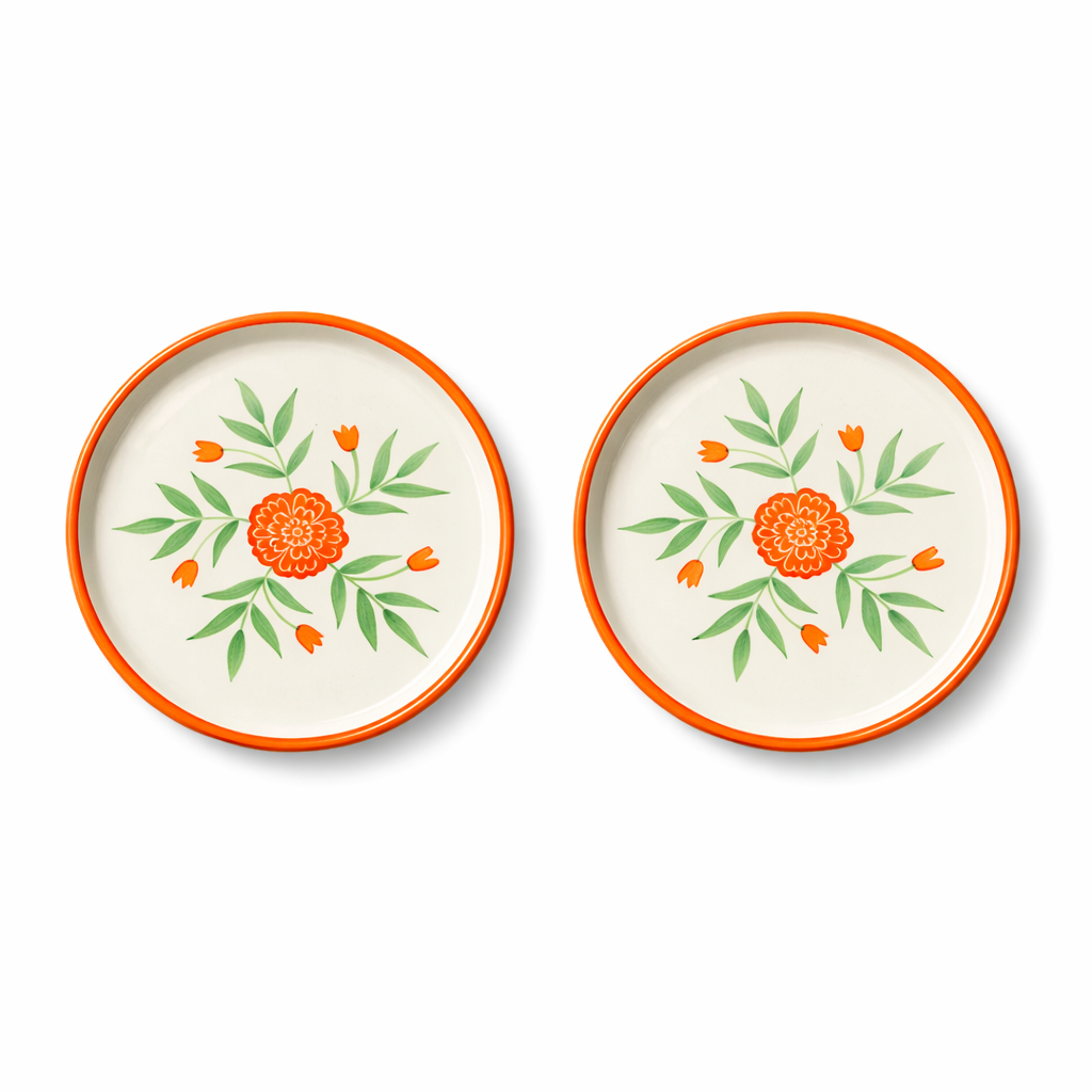 Two decorative plates with floral patterns on a white background