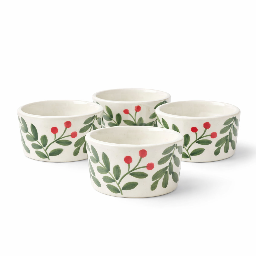 Set of four ceramic bowls with floral and berry design on a white background