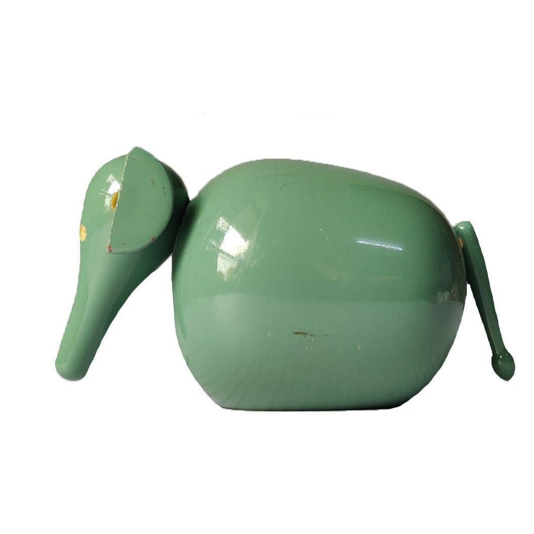 a close up of a green object on a white background