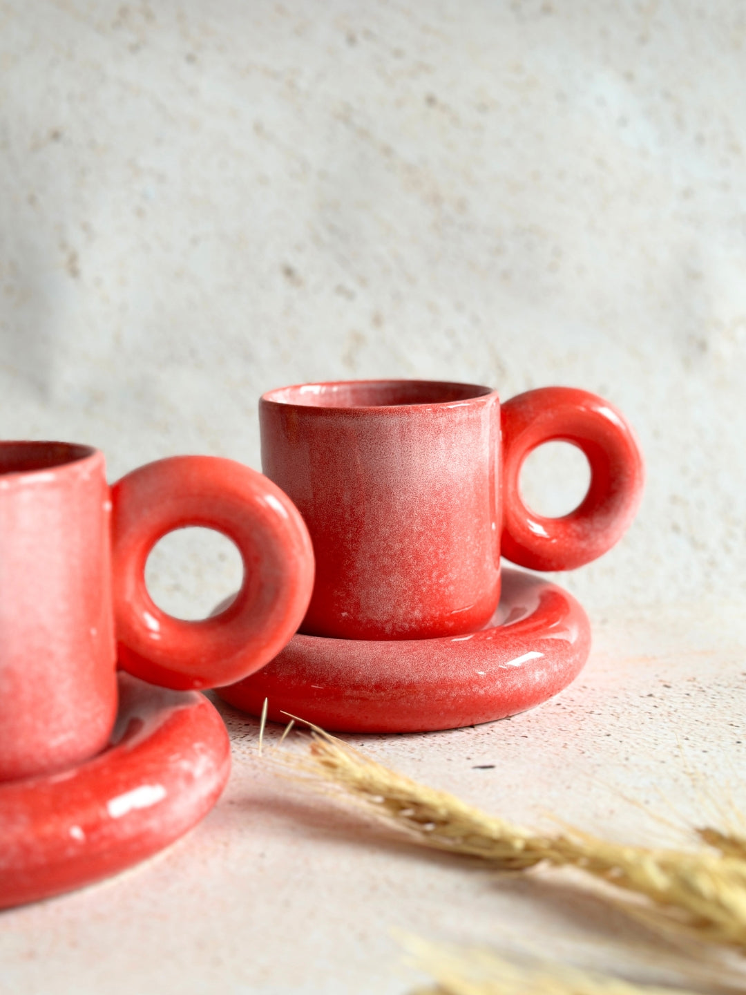 a couple of red cups sitting on top of a table