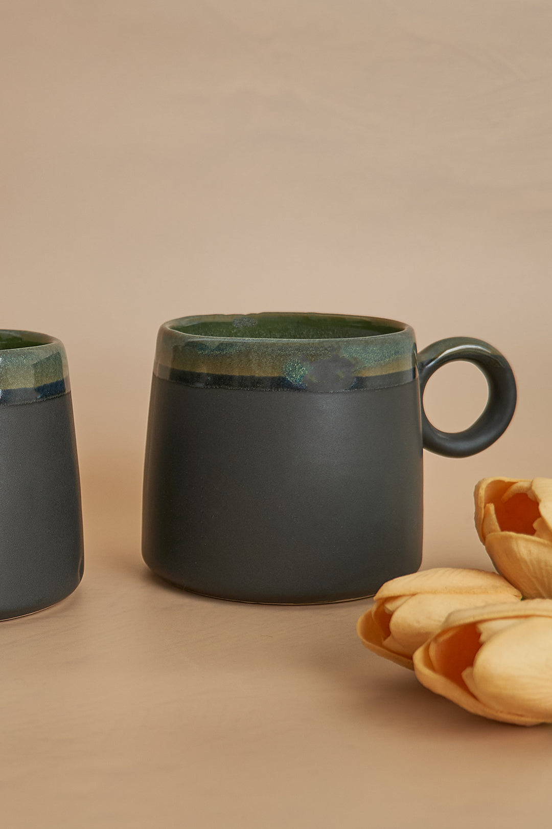 a couple of mugs sitting on top of a table