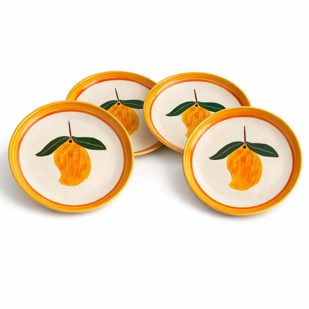 Set of four coasters with orange design on a white background