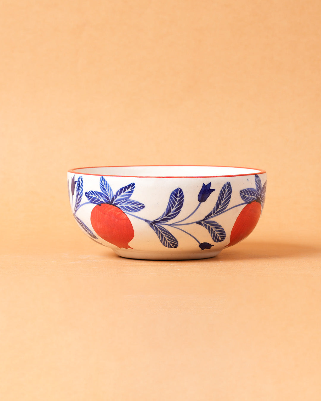 Ceramic bowl with floral design on a beige background