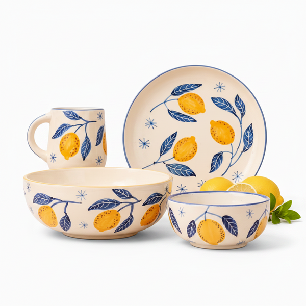 Ceramic tableware set with lemon and leaf pattern on a white background
