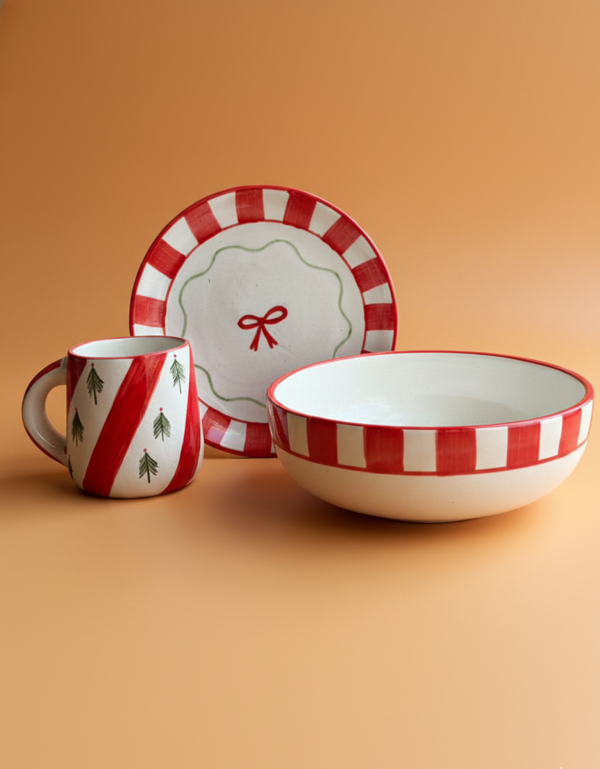 Ceramic tableware set with red and white stripes on a beige background