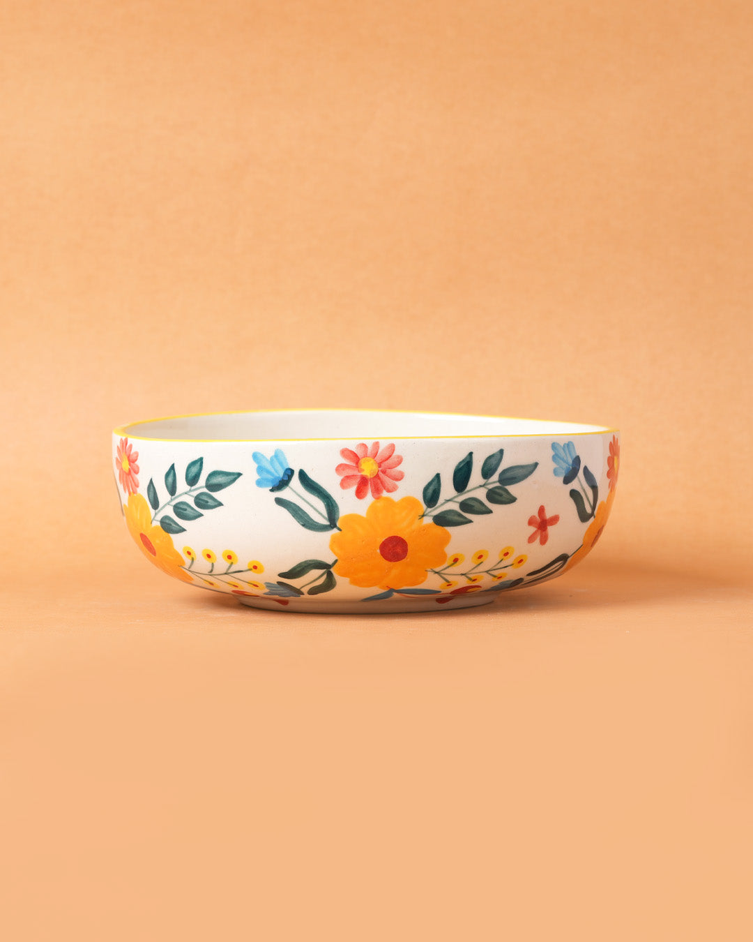 Decorative ceramic bowl with floral patterns on a beige background