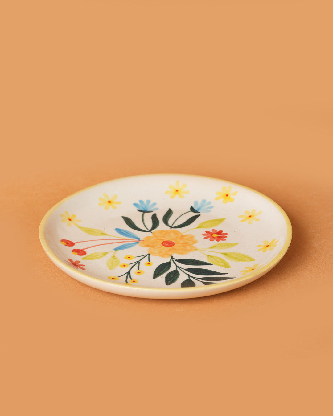 Decorative plate with floral design on a beige background