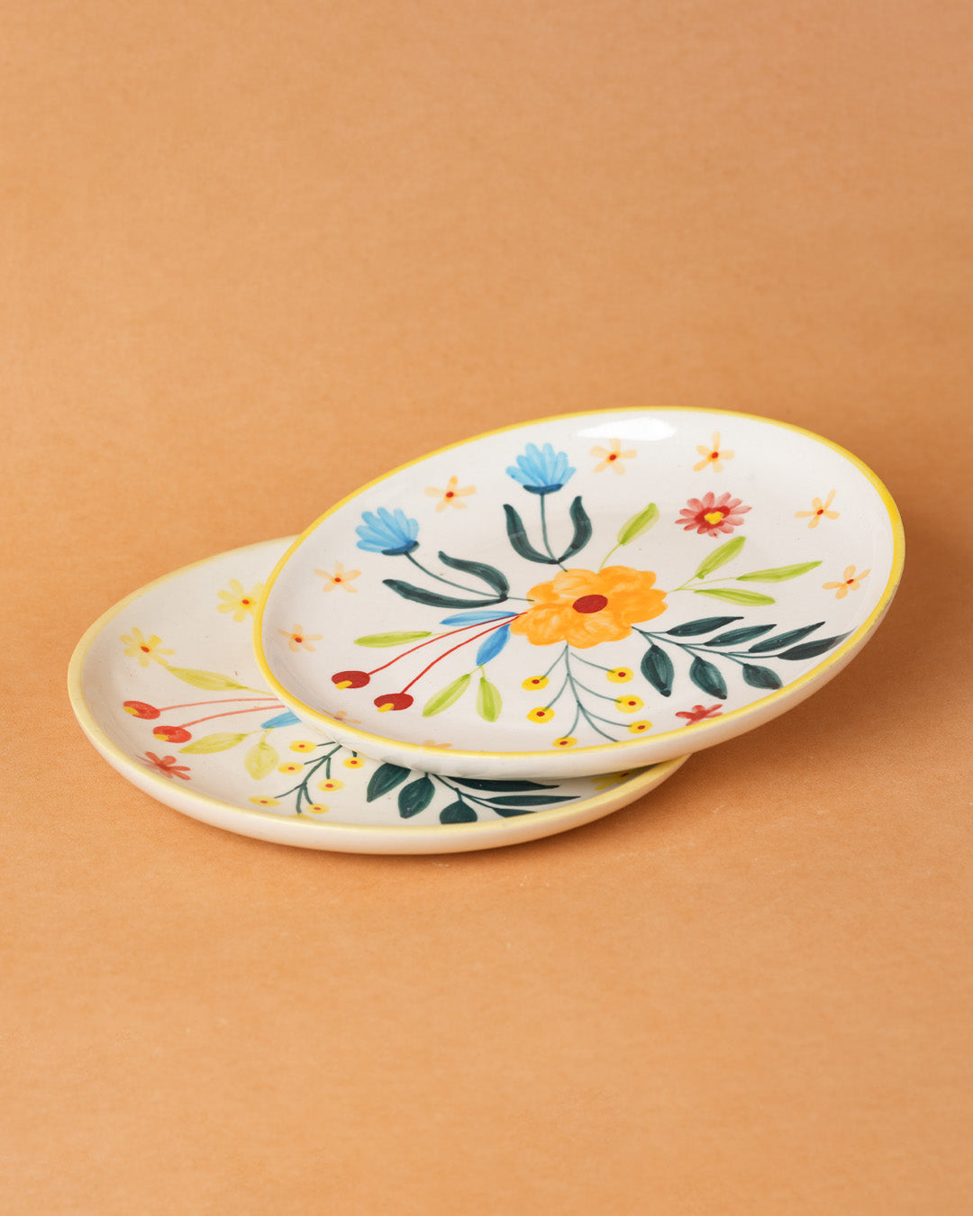 Decorative ceramic plate with floral design on a beige background