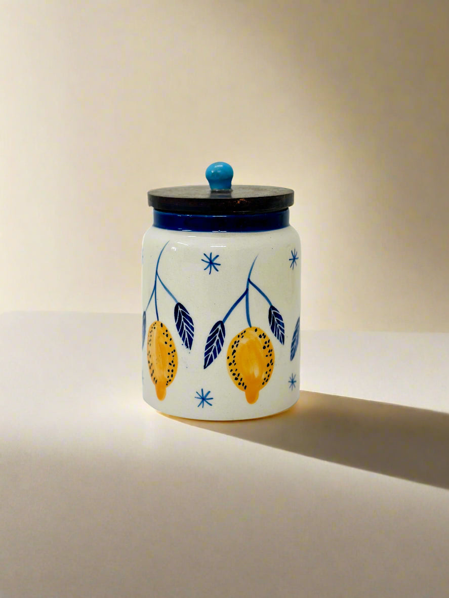 Ceramic jar with decorative design on a white background