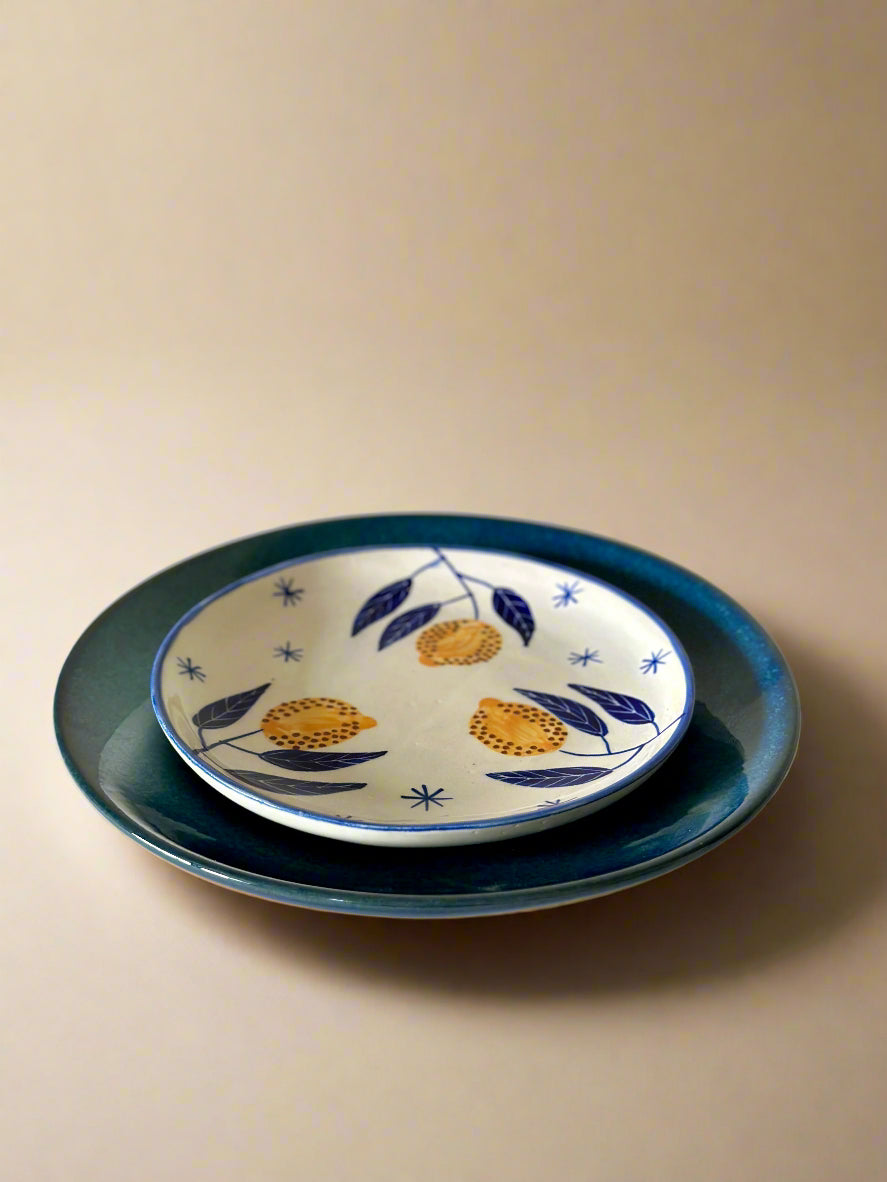 Ceramic plates with floral design on a beige background