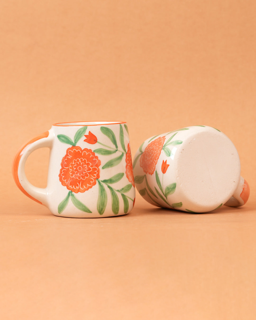 Ceramic mug with floral design on a beige background
