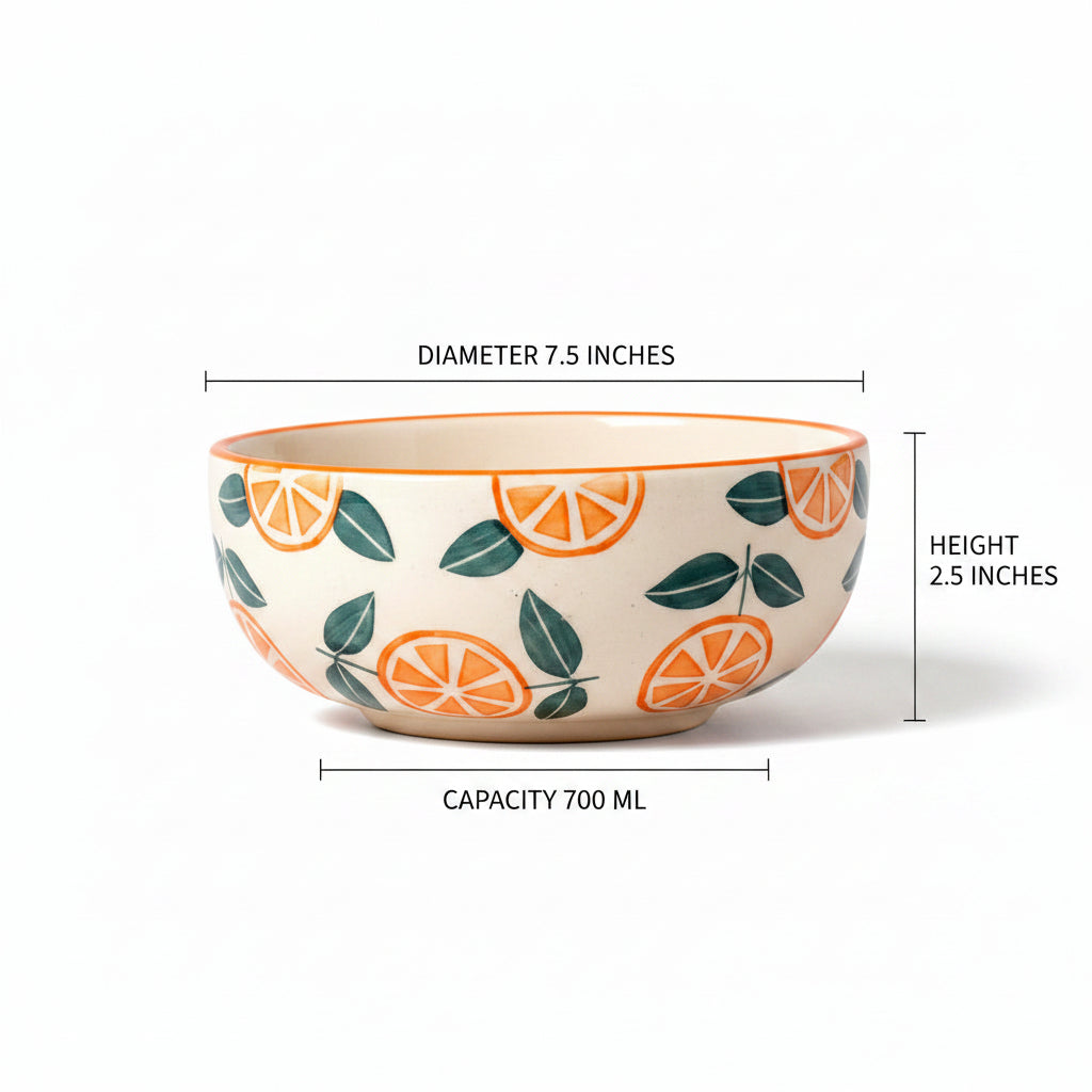 Two ceramic bowls with orange and leaf pattern on a peach background