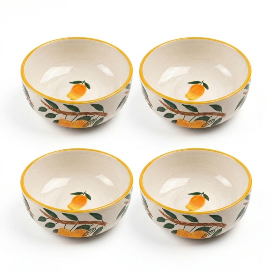 Four ceramic bowls with orange design on a white background