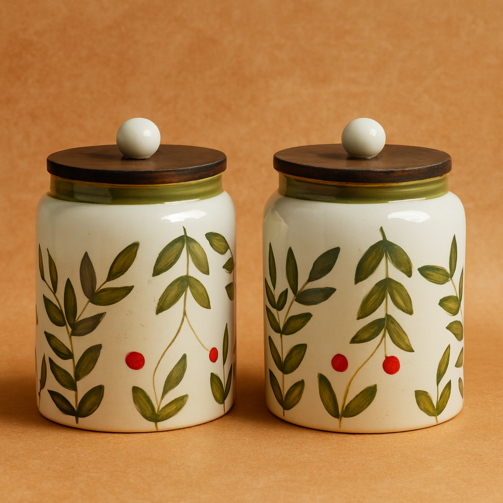 Two ceramic jars with leaf and berry design on a beige background