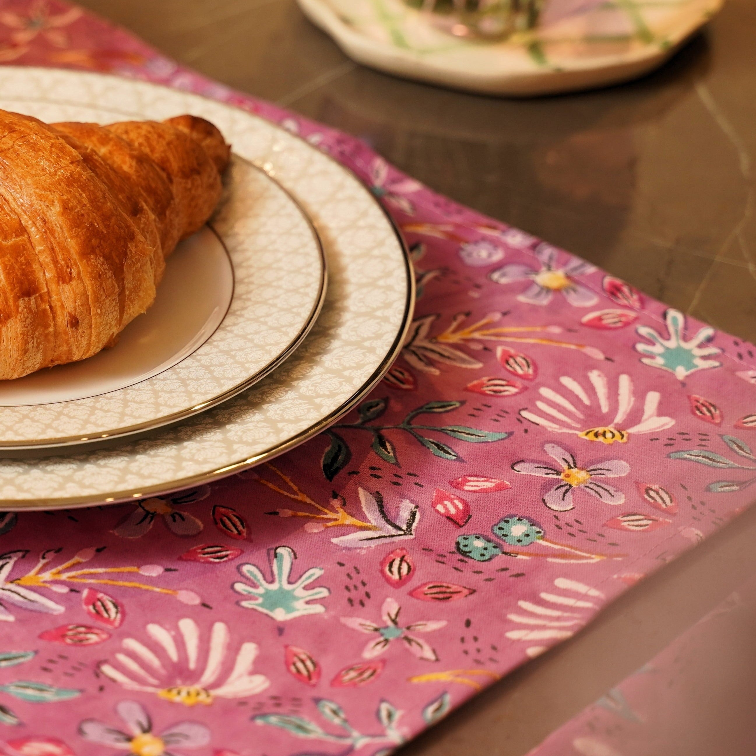 a croissant sitting on a plate on a table