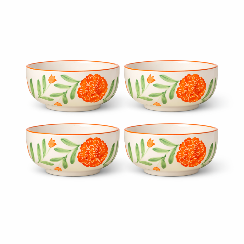 Four ceramic bowls with floral design on a white background