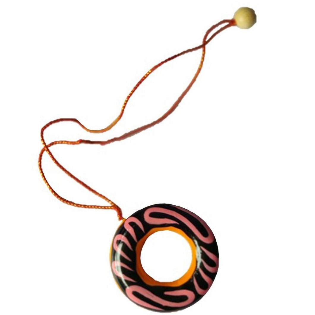 a necklace with an orange and black design on it