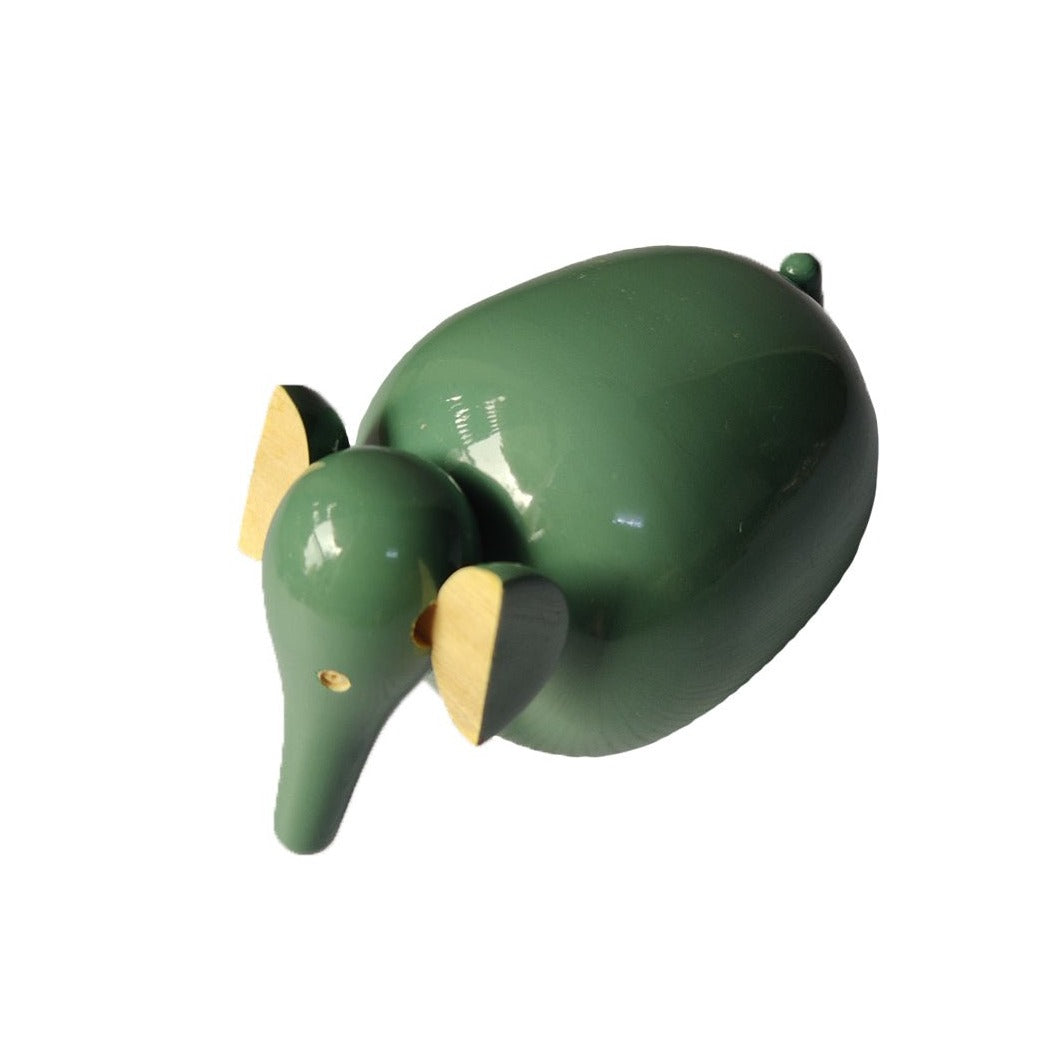 a green elephant figurine with a yellow nose