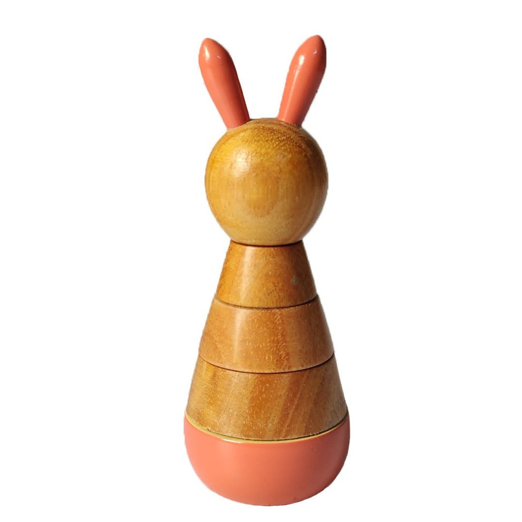 a wooden toy with two ears on top of it